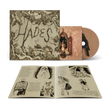 Imagen del CD de Melanie Martinez HADES con libro de historias, en la portada se muestra arte del álbum y el disco en primer plano.